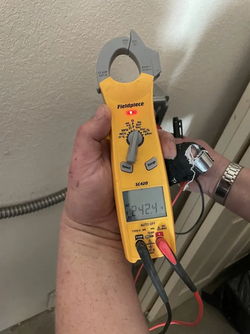 Voltage testing with clamp meter during Electrical Installation Services in Warrenton